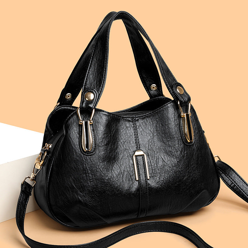 Close-up of splicing element and fabric accents on handbag