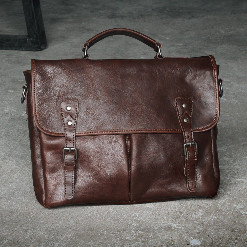 Open view showing inside compartments of leather bag