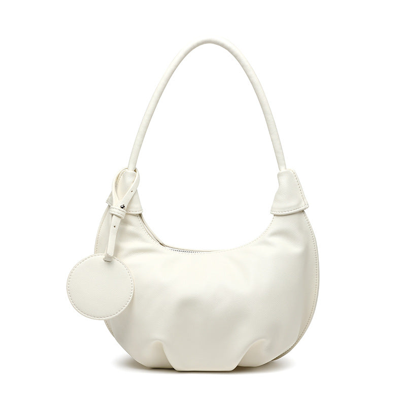 White PU leather dumpling purse with soft structure