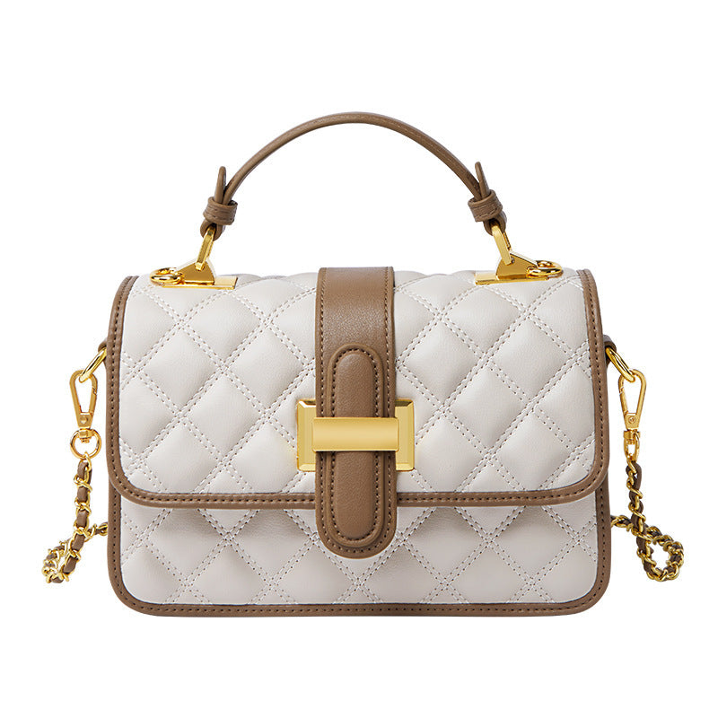 Milky white cowhide crossbody bag styled with neutral outfit