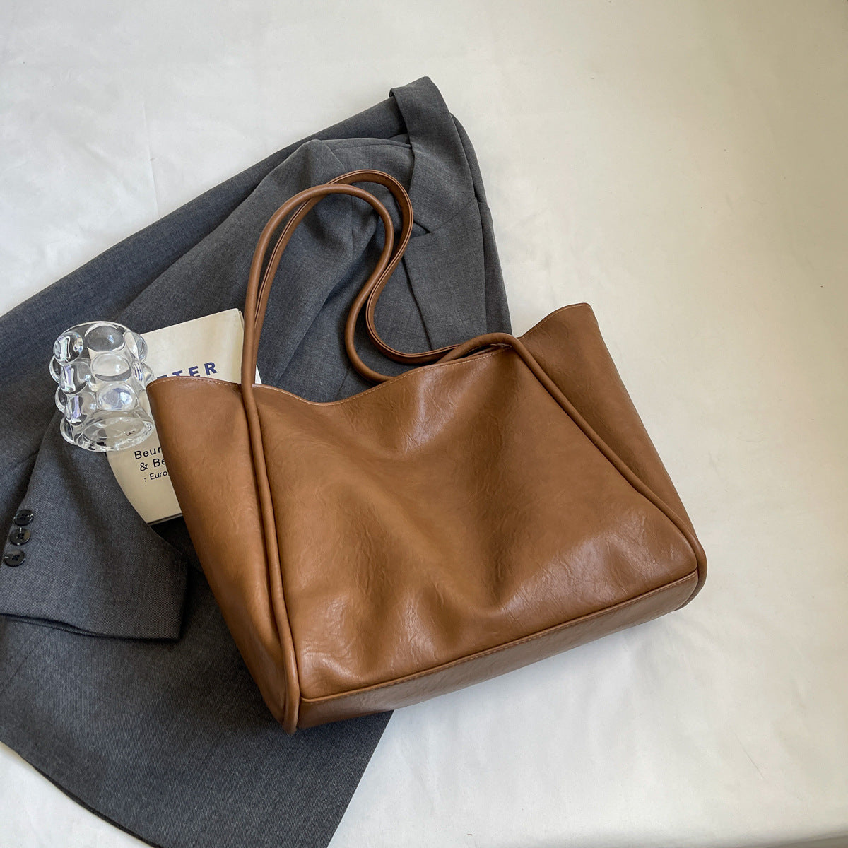 Milky white PU leather shoulder bag styled for everyday wear