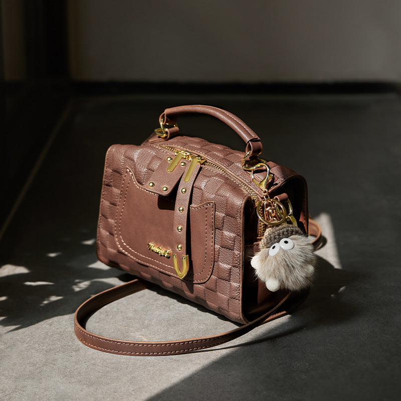 Close-up of sewing thread and cowhide texture of Boston bag