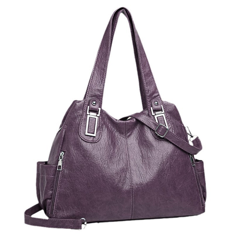 Woman wearing large PU leather European-style shoulder tote bag