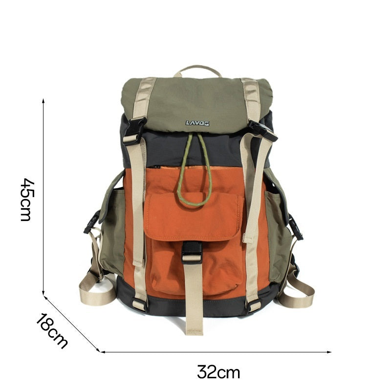 Unisex model wearing orange-green waterproof outdoor travel backpack