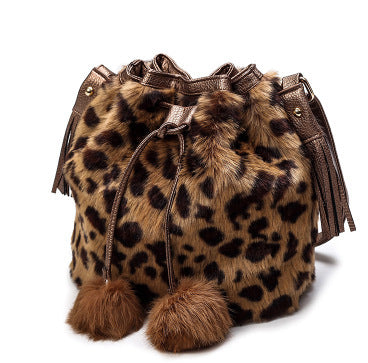 Soft surface texture of the plush bucket bag, highlighting its elegant stitching