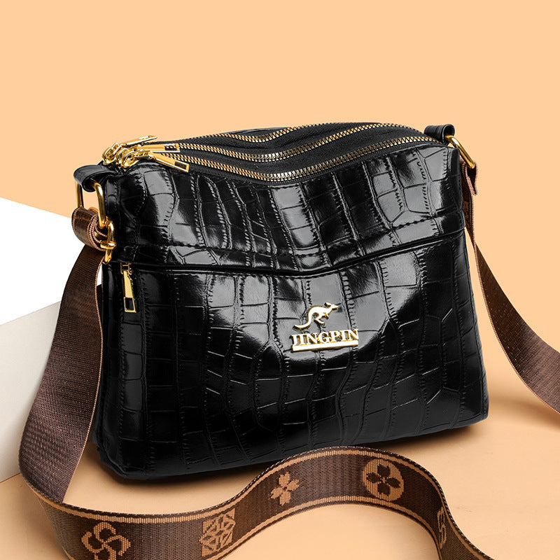 Side view of soft PU leather crossbody bag with spacious design