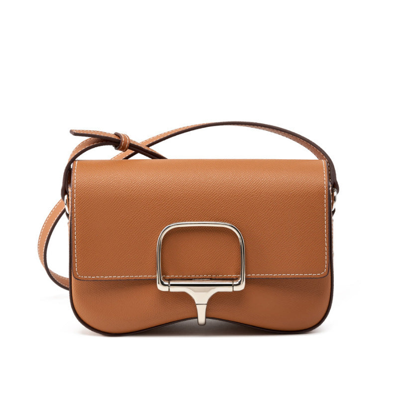 Side view of oval-shaped palm print leather bag
