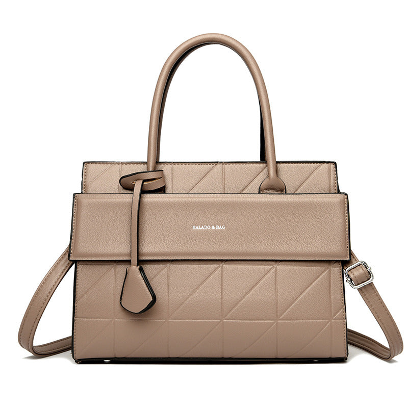 Model carrying silver retro tote bag