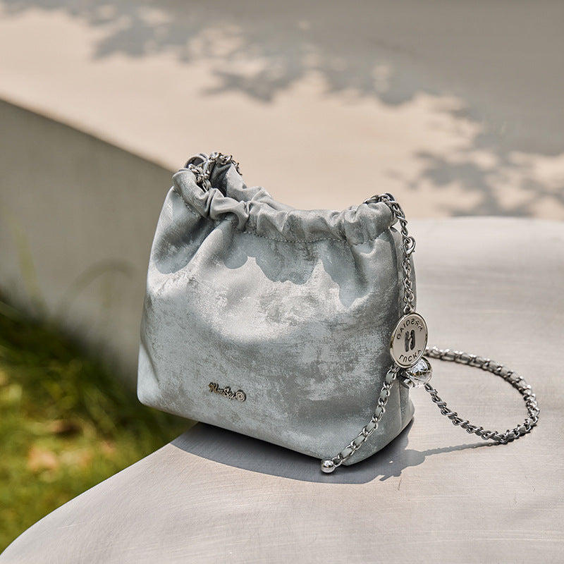 Close-up of space silver chain bag showing stitching details