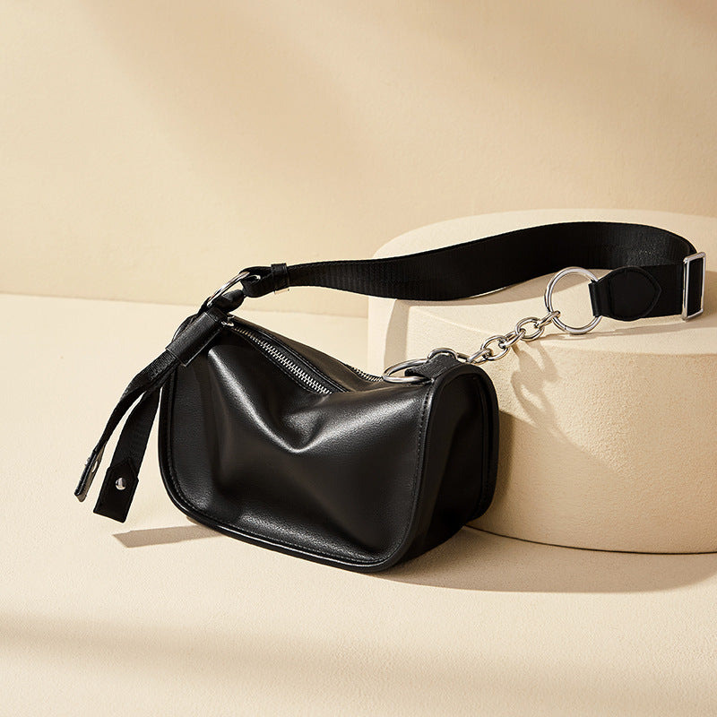Black underarm crossbody styled with casual street outfit