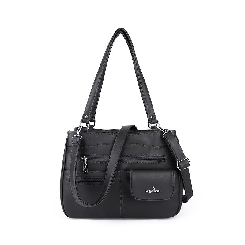 Stylish black PU tote bag with gold chain accents