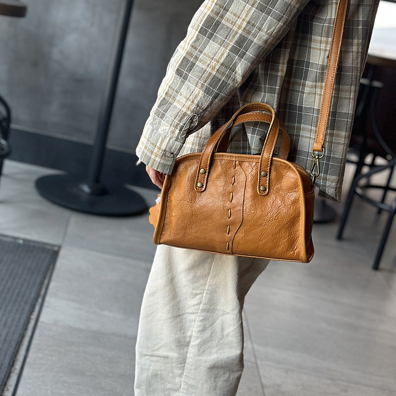 Simple retro leather crossbody with top handle and clean lines