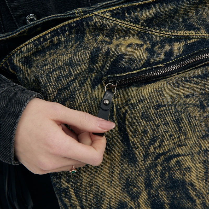 Close-up of washed black tassel details