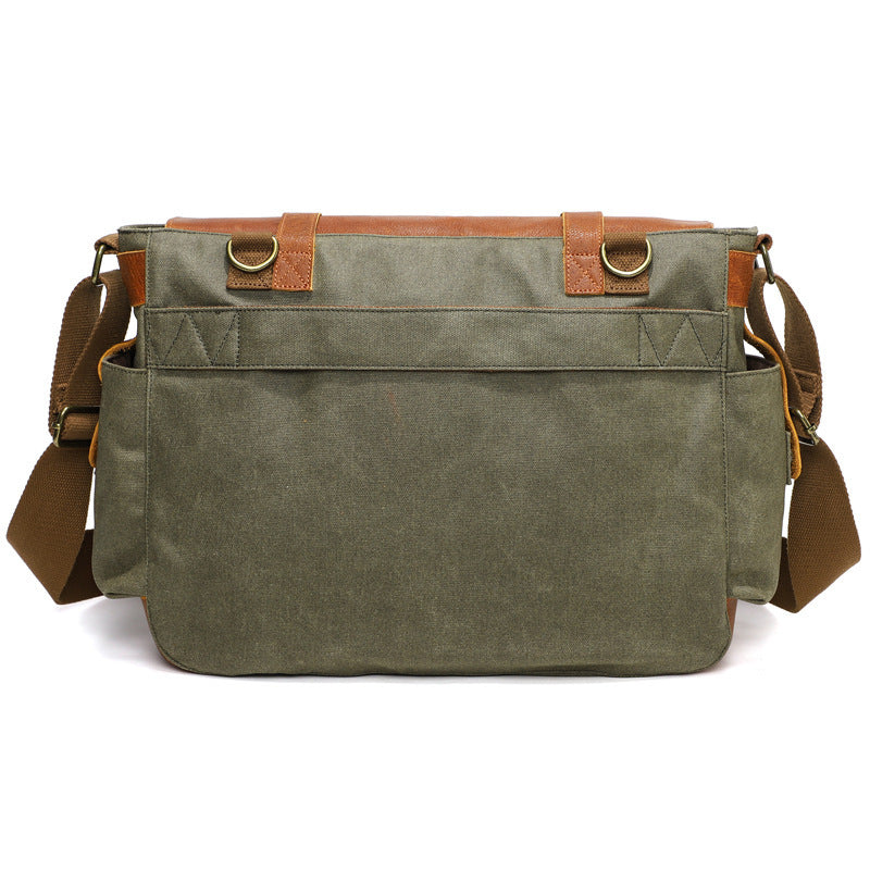 Gray waxed canvas crossbody bag with leather-trimmed back pocket