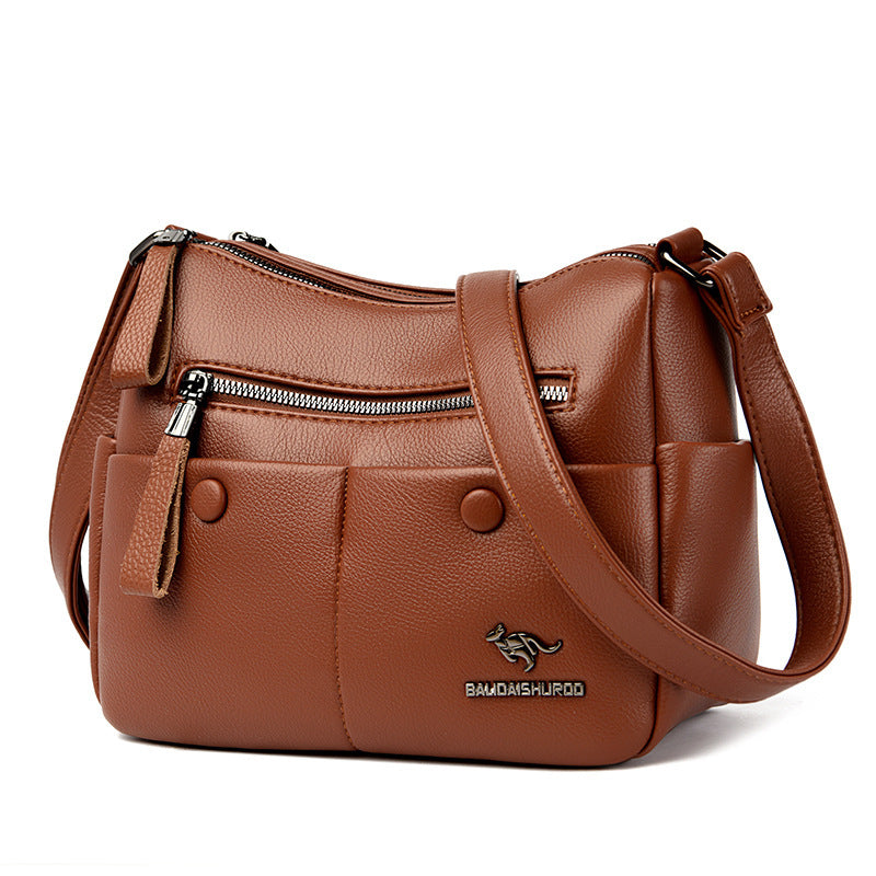 Close-up of stitching and zipper pocket on PU leather tote bag