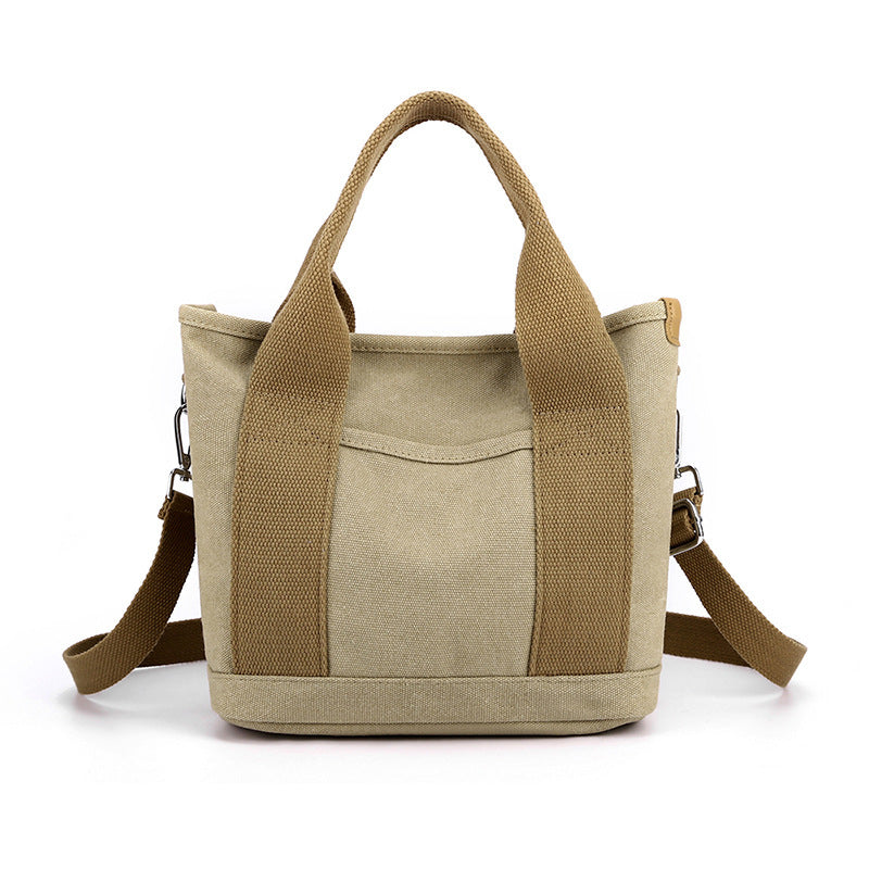 Beige tote bag with brown accents on a white background