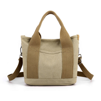 Beige tote bag with brown accents on a white background
