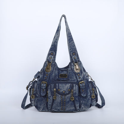 Blue denim handbag with gold accents on a white background
