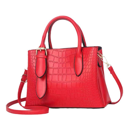 Red handbag with a crocodile texture