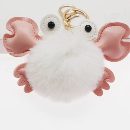Fluffy white keychain with pink accents