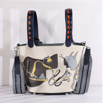 Handbag with horse-themed design on a light background
