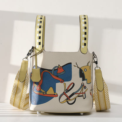 Handbag with horse and tack design on a white background