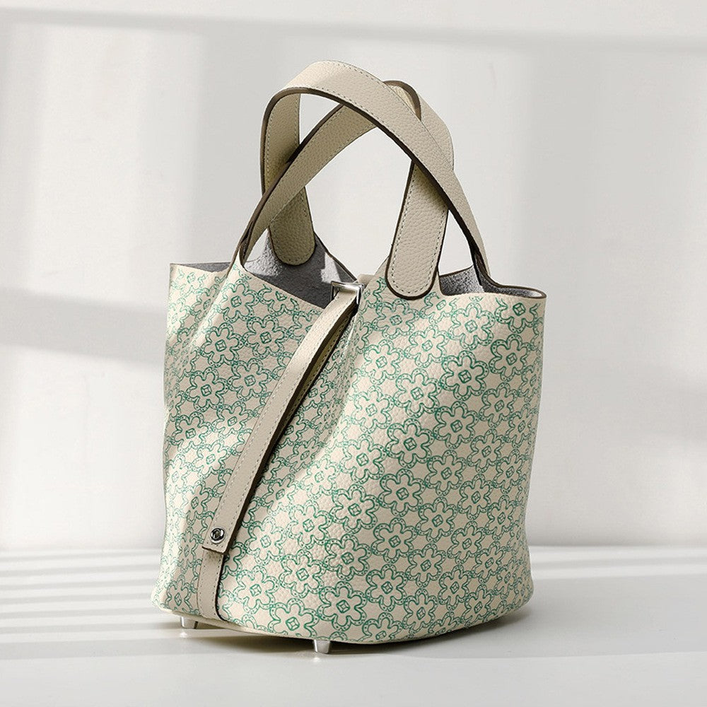 Patterned tote bag with beige straps on a light gray background