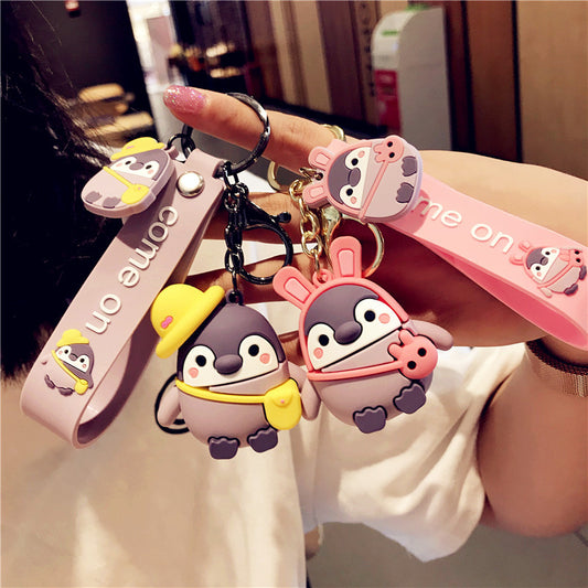 Pink cartoon penguin keychain close-up