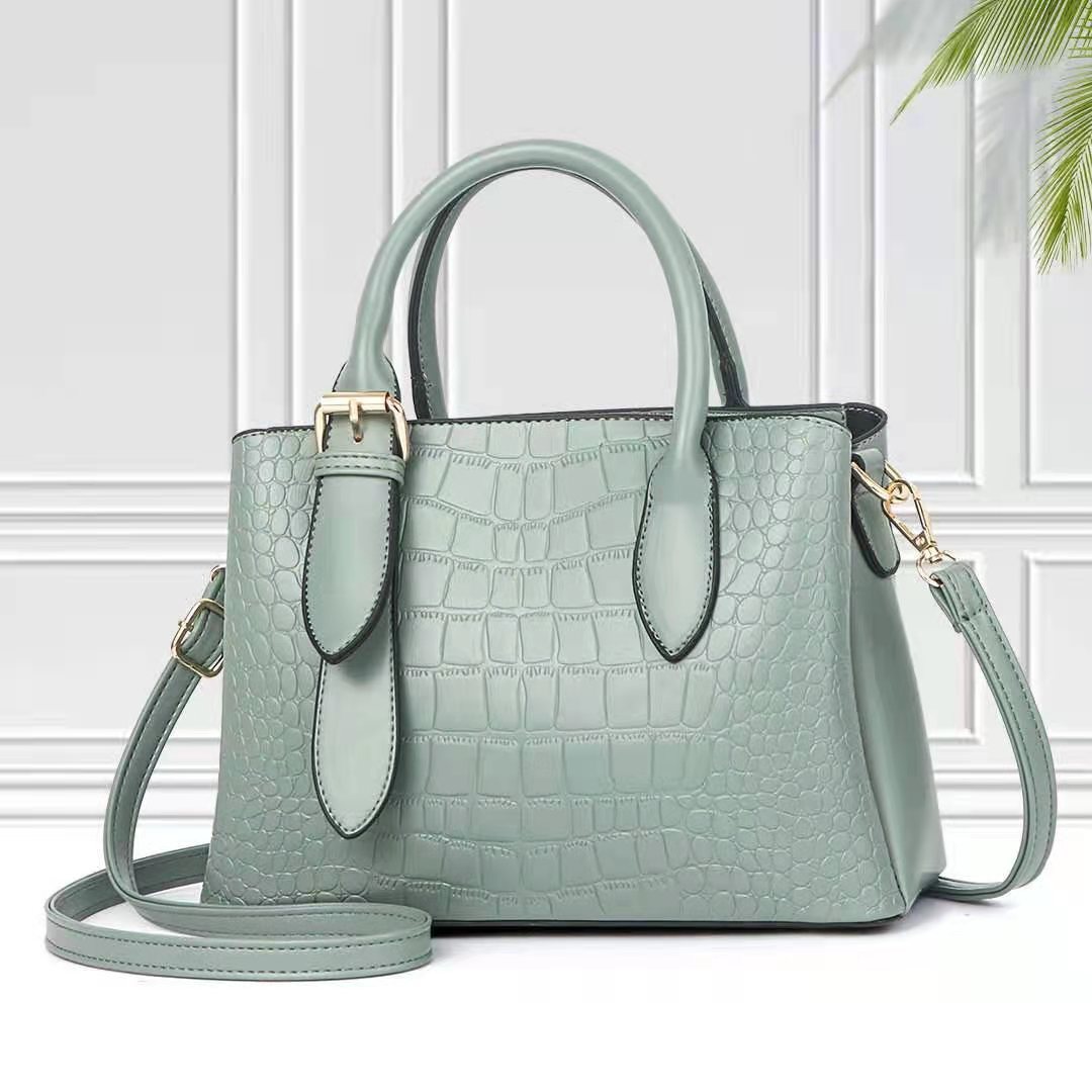 Light green handbag with crocodile texture
