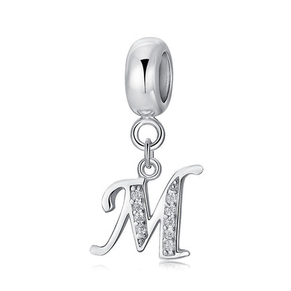 Silver charm with letter M
