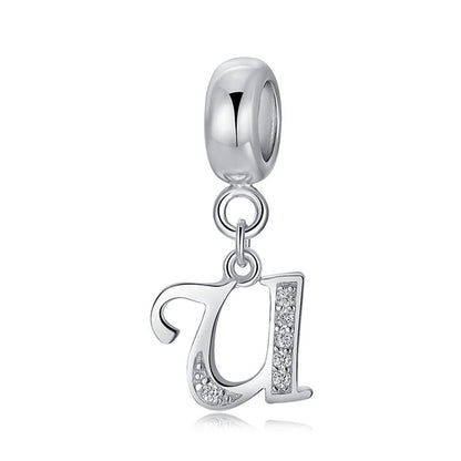 Silver charm with letter U