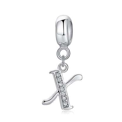 Silver charm with letter X