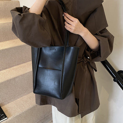 Black bucket-style shoulder handbag for women