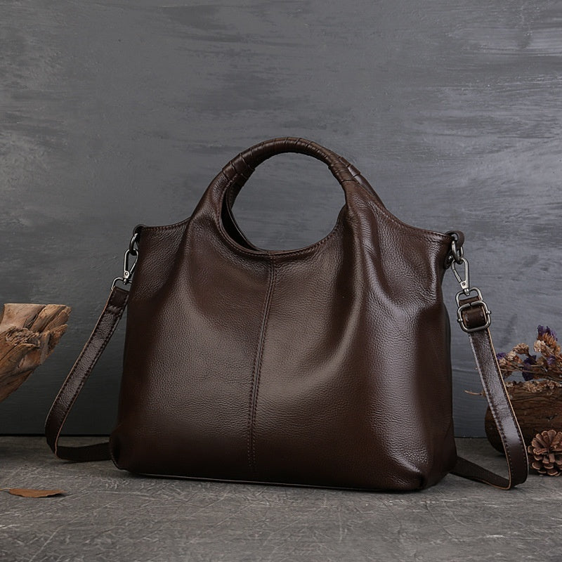 Side profile of brown cowhide tote bag