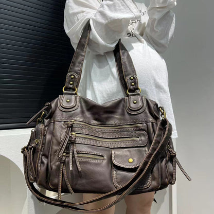 Brown distressed leather tote with zipper compartments