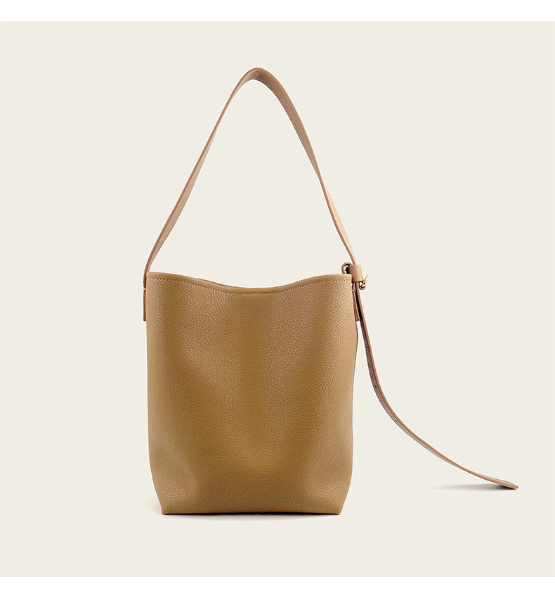 Back view of grass green cowhide leather crossbody bucket bag