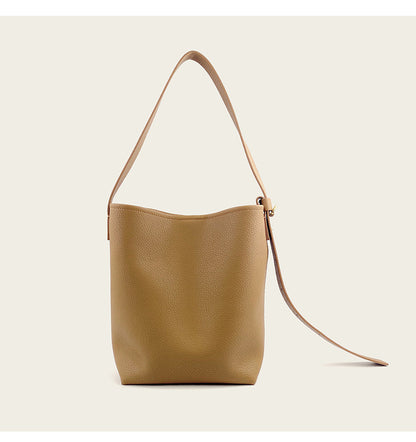 Back view of grass green cowhide leather crossbody bucket bag