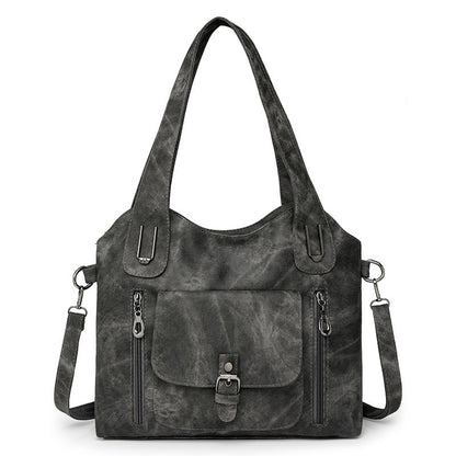 Model holding the bag crossbody style