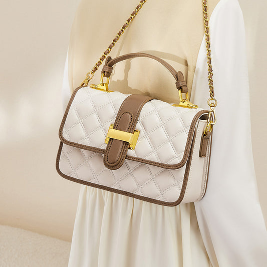 Front view of small autumn cowhide crossbody handbag