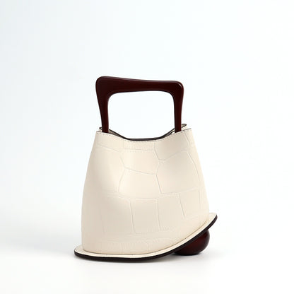 Model wearing the bucket bag with shoulder strap