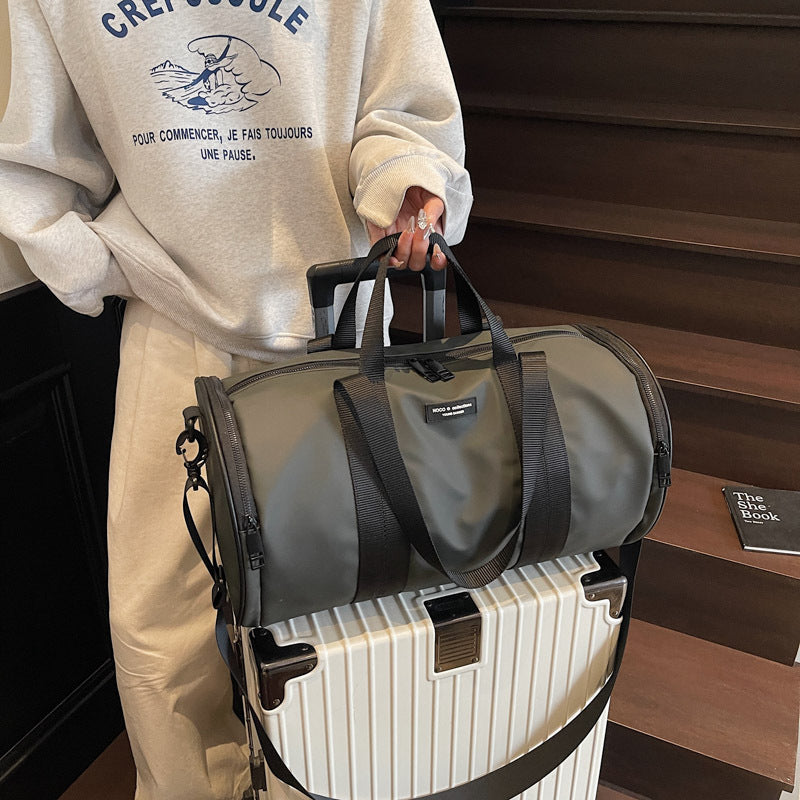 Dark gold waterproof Oxford sports bag shown from side