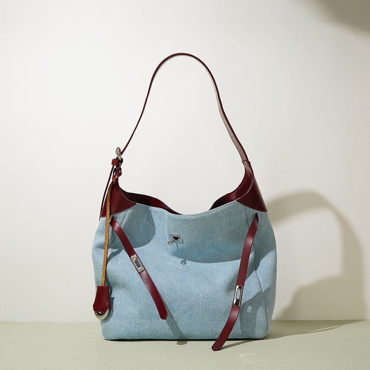 Women's denim and cowhide shoulder tote in blue