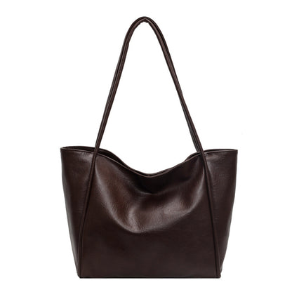 Close-up of PU leather texture and stitching on tote bag