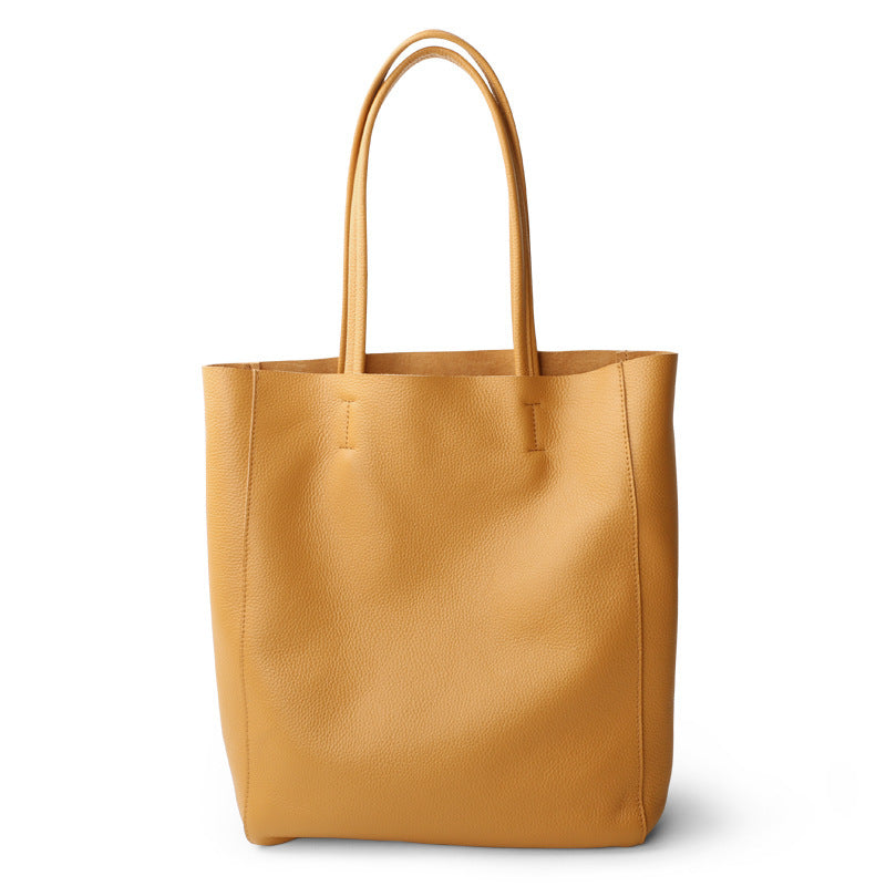 Model carrying bag with casual outfit