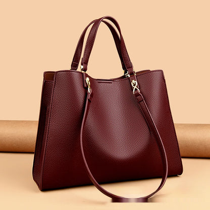 Interior compartments of PU leather women’s tote messenger bag