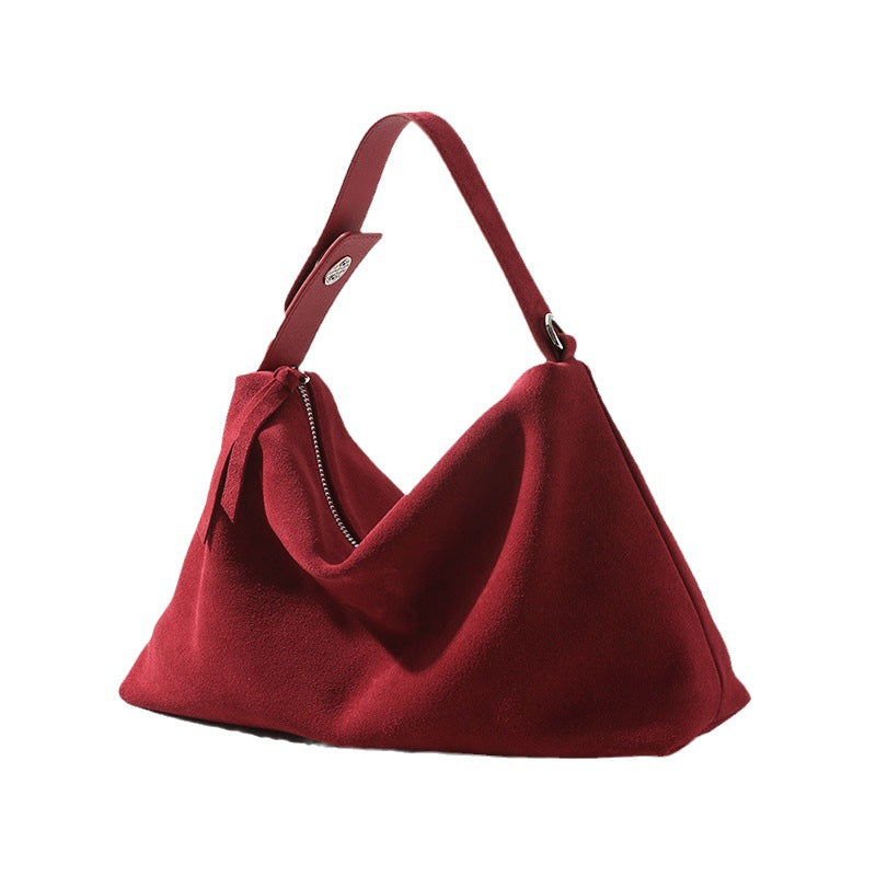 Red handbag on a white background