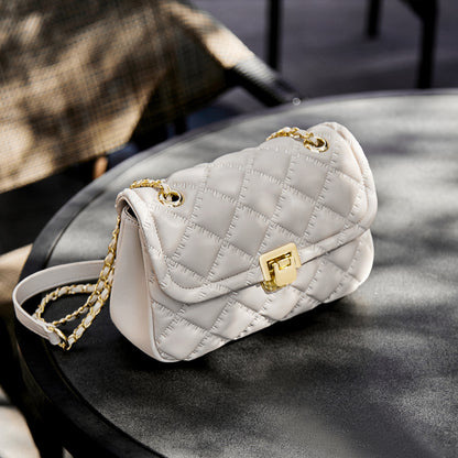 Side angle of beige genuine leather chain shoulder purse