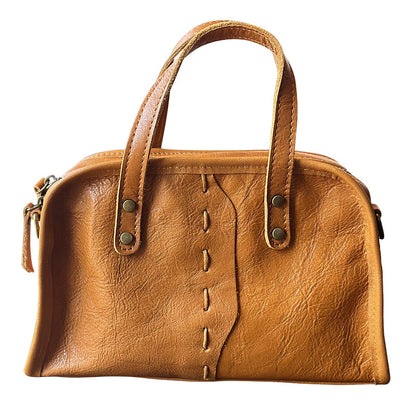 Side view of lightweight cow leather shoulder bag for women