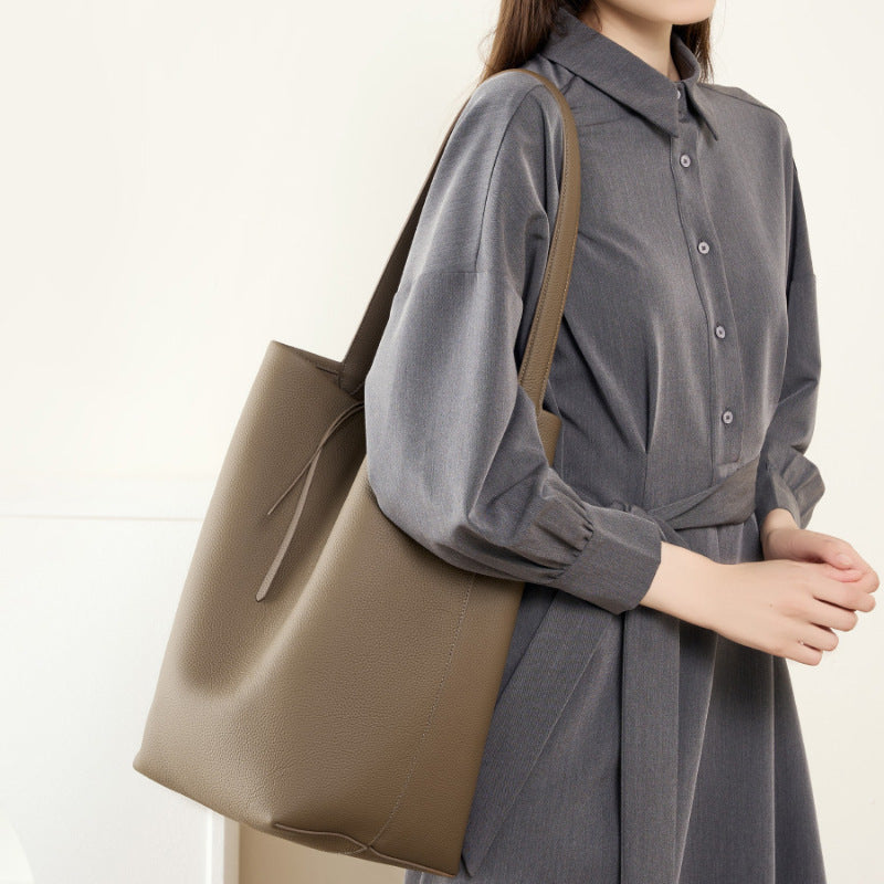 Apricot leather bucket bag in vertical square silhouette
