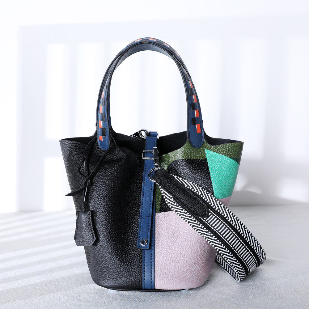 Black and blue leather bucket bag with detachable strap